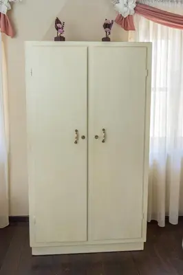 a pair of white cabinets in a room at Casa Di Porto in Chania Town