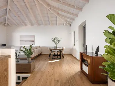 a living room with a table and a couch at Casa Domenica, 2 bedroom seaside home in Chania Town