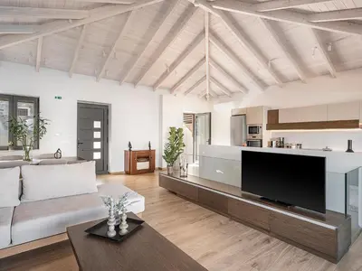 a living room with a large flat screen tv at Casa Domenica, 2 bedroom seaside home in Chania Town