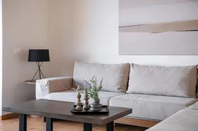 a living room with a couch and a coffee table at Casa Domenica, 2 bedroom seaside home in Chania Town