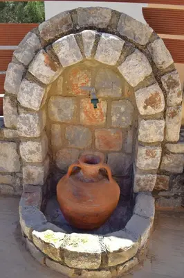 a vase sitting in a brick oven at Wild Tulip Escape in Kolymvari