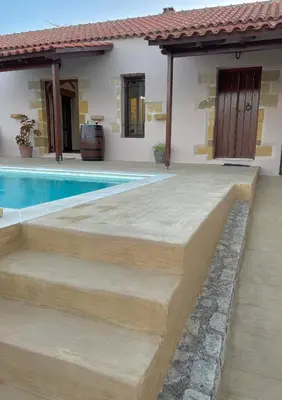 a home with a swimming pool and a house at Wild Tulip Escape in Kolymvari