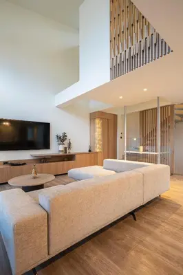 a living room with a couch and a tv at Alky Luxury Villa in Chania Town