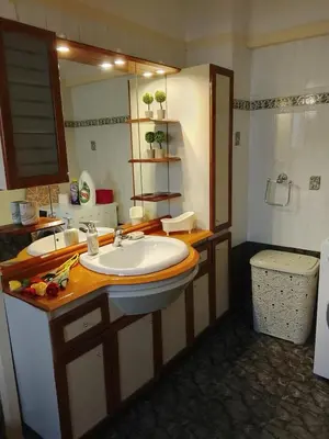 a bathroom with a sink and a mirror at Marilu apartment in the center of Chania in Chania Town