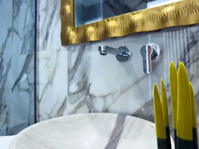 a bathroom with a white table and a mirror at Deluxe Center Suites in Chania Town