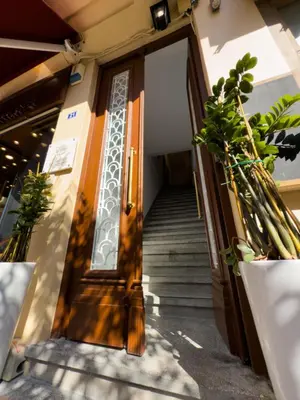 an entrance to a building with a wooden door at Deluxe Center Suites in Chania Town