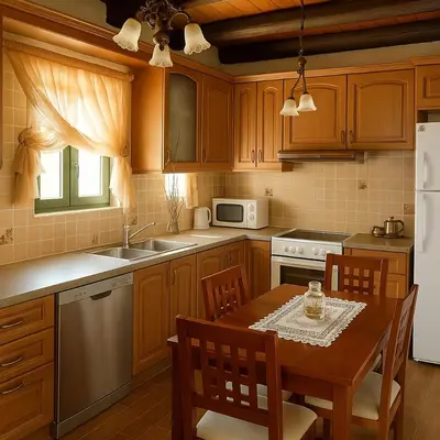 a kitchen with wooden cabinets and a wooden table with a tableablish at Chania's Diamond Villas - Aqua Bliss with Private Pools in Gavalochori