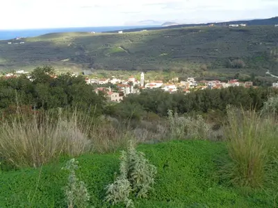 a view of a city from a hill at Apartment in natural stone house in Spiliá