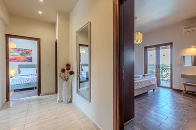 a room with two beds and a mirror at Anna by Vintage Travel in Troúlous
