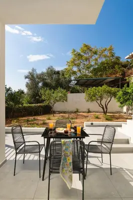 a black table and chairs on a patio at Ethea Residences-Thalia in Chania Town