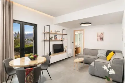 a living room with a couch and a table at Ethea Residences-Helia in Chania Town