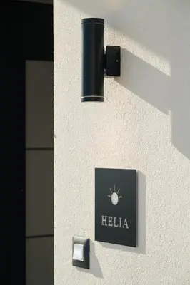 a sign on the side of a building with a hello sign at Ethea Residences-Helia in Chania Town