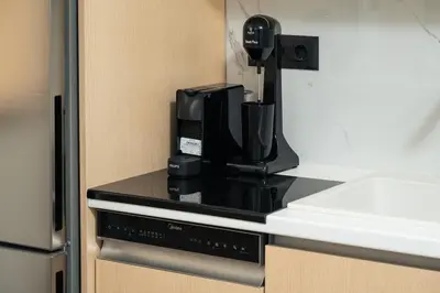 a coffee maker sitting on top of a kitchen counter at Ethea Residences-Helia in Chania Town