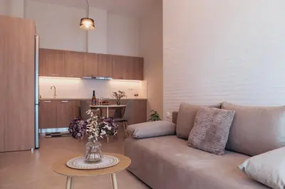 a living room with a couch and a table at MP Apartments in Chania Town