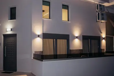 a building with lights on the side of it at MP Apartments in Chania Town