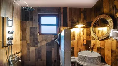 a bathroom with a sink and a mirror at La Irilia Residences & Retreat in Agios Padeleimon