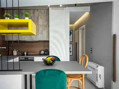 a kitchen with a table with a bowl of fruit on it at Amazing views in Chania Town