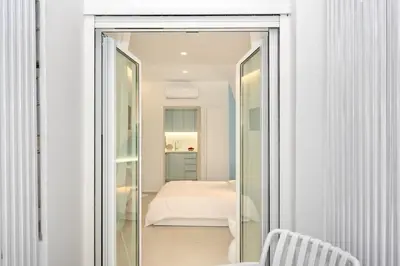 a room with a mirrored door leading to a bedroom at Αthena Studio 3 in Chania Town