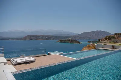 a swimming pool with a view of the water at Only View Villa - Timeless Coastal Retreat by etouri in Chania