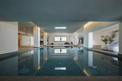 a large swimming pool in a house at Only View Villa - Timeless Coastal Retreat by etouri in Chania