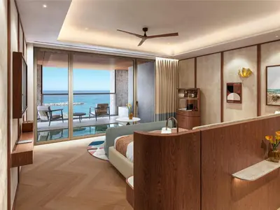 a hotel room with a view of the ocean at Hilton Chania Old Town Resort & Spa in Chania Town