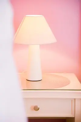 a white lamp sitting on top of a table at Creta Sea View 2BR Maisonette by ΜΡS in Marathokefála