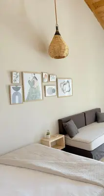 a white bedroom with a bed and a couch at Athina's Cozy Guest House in Kamisianá