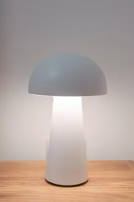 a white mushroom table on top of a wooden table at Hanim 2BR Loft Apartment - Garden & Indoor Parking in Chania Town