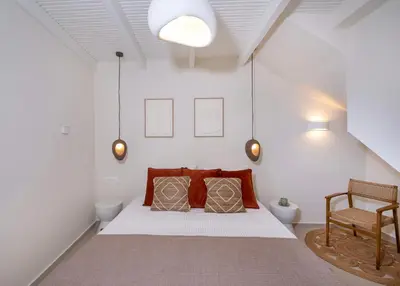 a bedroom with a bed with two pillows on it at BŌW 1st Floor Luxury Apt -Heart of Chania Old Town in Chania Town