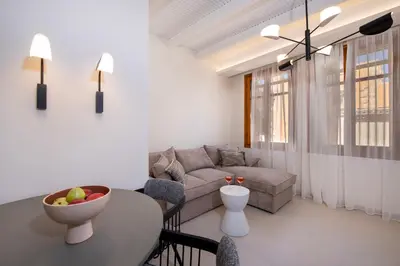 a living room with a couch and a table at BŌW 1st Floor Luxury Apt -Heart of Chania Old Town in Chania Town