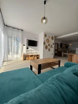 a living room with a couch and a table at Villa & Apartament Armonia 3 Gaja Flora Gavalochori - Vamos KRETA in Vamos