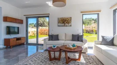 a living room with a couch and a table at Villa Alen in Áptera