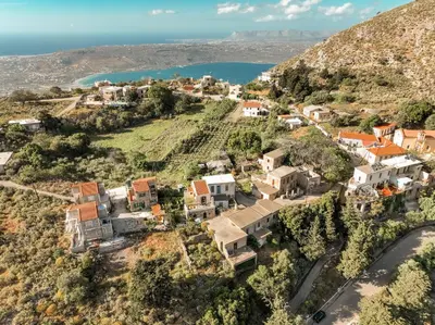 an aerial view of a village on a hill at Maria's Serene Countryside Retreat in Chania Town