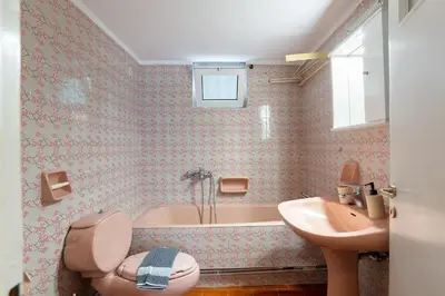a bathroom with a sink and a toilet and a tub at Chania Experience Residence in Chania Town