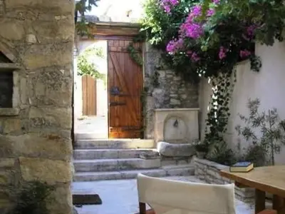 a room with a door and stairs with a table and chairs at Holiday Home in Douliana mit Großem Balkon by Interhome in Douliana
