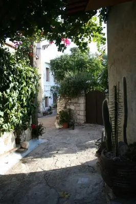 an alley with cactuses and plants in a building at Holiday Home in Douliana mit Großem Balkon by Interhome in Douliana