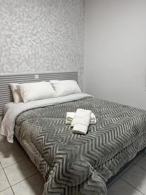 a bed with two towels on top of it at Oneiro Apartment in Kounoupidhianá