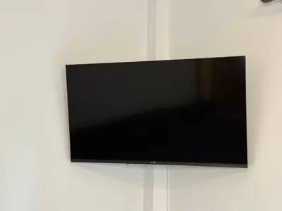 a flat screen tv hanging on a wall at Oneiro Apartment in Kounoupidhianá