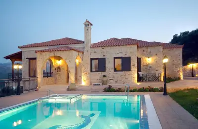 a large swimming pool in front of a house at Dream Hill Villas in Tavronitis