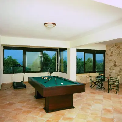 a large room with a pool table in it at Dream Hill Villas in Tavronitis