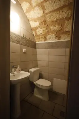 a bathroom with a toilet and a sink at SternesVillage, Middle Ground Floor in Stérnai