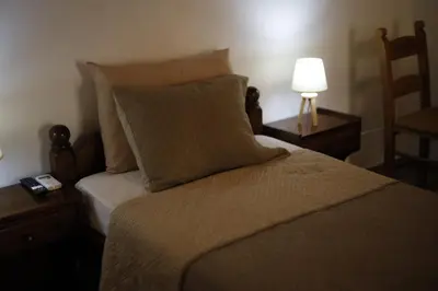 a bedroom with a bed with a lamp and a bed sidx sidx sidx at SternesVillage, Middle Ground Floor in Stérnai