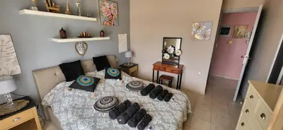 a bedroom with a bed with pillows on it at Aphrodite villa in Darmarochori