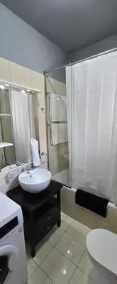 a bathroom with a sink and a shower at Aphrodite villa in Darmarochori