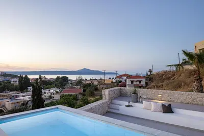 a villa with a swimming pool and a view at Villa EsHi w Private Pool & Scenic Sea View in Kalyves
