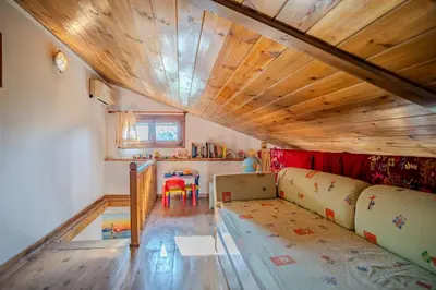 a living room with a couch and a table at Traditional Art House Armenoi in Arménoi
