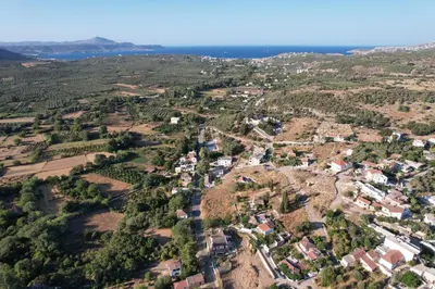 an aerial view of a small village in the hills at Traditional Art House Armenoi in Arménoi