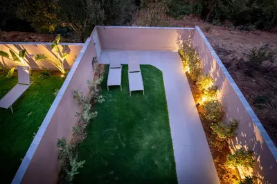 an overhead view of a garden with two benches at Mystrali I in Galatás