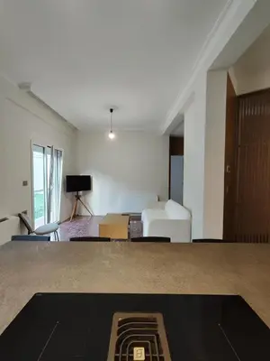 a living room with a bed and a couch at Apartment Near Beach & Old Port in Chania Town