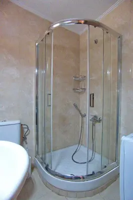 a shower with a glass door in a bathroom at Peris #2 - Souda in Souda